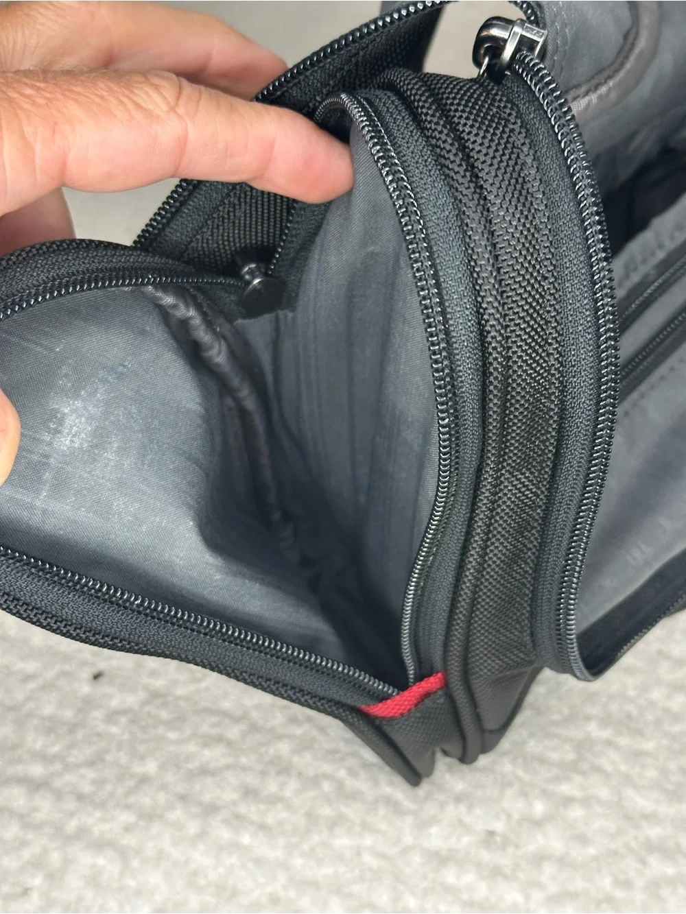 Tumi Black Toiletry Bag with Red Accents